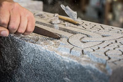 Chiseling Granite Headstone